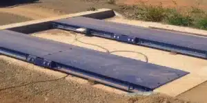 A permanent truck scale installed at an industrial site.